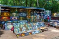 Cambodia. Angkor. Banteay Kdei Temple. Merchant of souvenirs painting at the entrance of temple