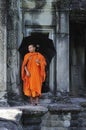 Cambodia Angkor wat gallery with a monk Royalty Free Stock Photo