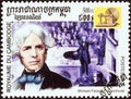 CAMBODIA - CIRCA 2001: A stamp printed in Cambodia from the `Millennium` issue shows Michael Faraday, electric motor, circa 2001.