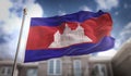 Cambodia Flag 3D Rendering on Blue Sky Building Background