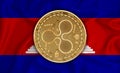 Cambodia flag, ripple gold coin on flag background. The concept of blockchain, bitcoin, currency decentralization in the country.