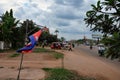 Cambodia, Siem Reap 12/08/2018 Cambodia flag swaying in the wind, street of an Asian city, red tuktuk