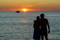 Cambodia. Koh Rong Samloem Island, young couple admiring the sunset
