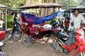 Cambodia - Rickshaws parking with sleeping driver