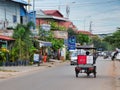 Auto rickshaw rides along the road, street trading on the sidelines