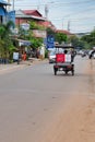 Auto rickshaw rides along the road, street trading on the sidelines