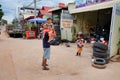 Cambodia, Siem Reap 12/08/2018 a man with a child in his arms near the tire shop, slums of Asia, residents of poor areas of the