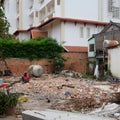 Cambodia, Siem Reap 12/08/2018 man in a red shirt sitting on a pile of construction waste