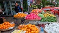 Young Asian girl sells fruit on a city street