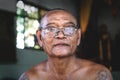 Cambodian buddhist monk with glasses at temple Wat Krabi Riel Pagoda, Siem Reap Province, Cambodia