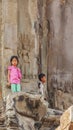 Cambodian children stand at entrance of the tower, Angkor Wat, Siem Reap, Cambodia. Royalty Free Stock Photo