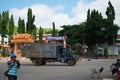 Cambodian driver driving garbage truck and working keeping junk on street and traffic road and life of cambodian people at Banteay