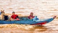 Cambodian family on a boat on Tonle Sap Lake. Royalty Free Stock Photo