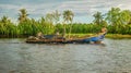 Cambodian fishermen in their boat on a river. Royalty Free Stock Photo