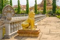 Cambodian five-headed naga and a lion as guardian statues in the