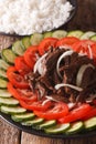 Cambodian food: beef Lok Lak with fresh tomatoes and cucumbers Royalty Free Stock Photo