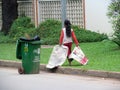 Cambodian girl cleans the street