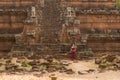 Cambodian Asian Girl in Traditional Dress Sits at Phimeanakas Temple in Angkor Thom