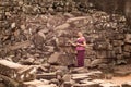 Cambodian Girl in Khmer Dress Standing by Ruins of Bayon Temple in Angkor City