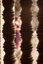 Girl in Traditional Dress Through a Carved Stone Window at Angkor Wat Temple Royalty Free Stock Photo