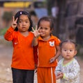 Cambodian girls in Muslim district of the town show their finger