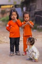 Cambodian girls in Muslim district of the town show their finger