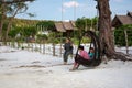 Cambodian girls siting on the swing,