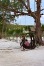 Cambodian girls siting on the swing