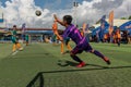 Cambodian goalkeeper in action trying catch the ball