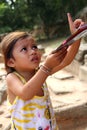 Cambodian Kid Selling Postcards Royalty Free Stock Photo