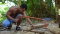 Cambodian man cut wood to build home construction