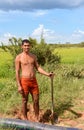 Cambodian Man Digging in Rice Field Tonle Sap Lake, Cambodia Royalty Free Stock Photo