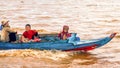 Cambodian people live on Tonle Sap Lake in Siem Reap, Cambodia. Cambodian family on a boat near the fishing village of Tonle Sap L