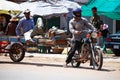 Cambodian people riding motorcycle and driving vehicle car and biking bicycle on street with traffic angkor wat road go to work at