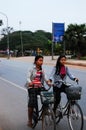 Cambodian people riding motorcycle and driving vehicle car and biking bicycle on street with traffic angkor wat road go to work at