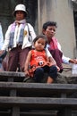 Cambodian senior old women and cambodia children girl people travel visit respect praying Angkor wat temple ancient ruins castle Royalty Free Stock Photo