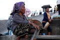 Cambodian senior old women people sit for sale product to foreign travelers travel visit West Mebon temple castle on island in