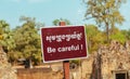 Be Careful Warning sign in Angkor Wat Temple