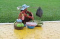 Cambodian woman sell fruits and stuff on the street