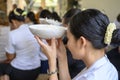 Cambodian women at food offering ceremony praying with bowls of rice. Pchum Ben Day