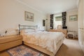 Traditional furnished cream coloured bedroom