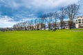 Cambridge, Cambridgeshire, United Kingdom - April 16, 2016. People cycling at Perkers Piece on a bright sunny day