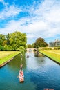 Cambridge, Cambridgeshire, United Kingdom - AUG 28, 2019: Tourists on punt trip along River Cam near Kings College in the city of Royalty Free Stock Photo