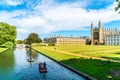 Cambridge, Cambridgeshire, United Kingdom - AUG 28, 2019: Tourists on punt trip along River Cam near Kings College in the city of Royalty Free Stock Photo