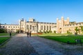 Students walking front of the famous Trinity college on a bright