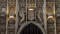 Architectural interior details of stone carved coat of arms above main entrance of Kings College Chapel Royalty Free Stock Photo