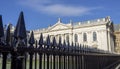 Cambridge, England. The black metal gate with pointed spikes of the Senate House of the University of Cambridge