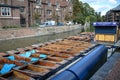 CAMBRIDGE, ENGLAND-JUNE 2009: Punts lined up on river circa June 2009 in University campus Cambridge England. The river and Royalty Free Stock Photo