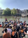 Cambridge, UK - April 20, 2019: People enjoying the weather and punting in the river Cam in Scudamore& x27;s punting station Royalty Free Stock Photo