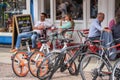 Cambridge, UK, August 1, 2019. Bicycles parked outside a restaurant along the narrow street